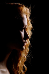 Wall Mural - profile of young pensive woman