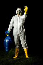 Man In Bio Hazard Protective Suit With Gas Mask And Gloves