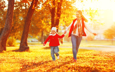 Poster - happy family mother and child little daughter on autumn walk