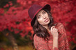 © ZoomTeam - Fashion woman on a background of red and yellow autumn leaves