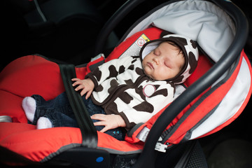 Baby asleep in car seat