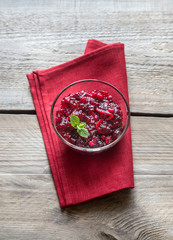 Sticker - Bowl of cranberry sauce on the wooden board