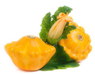 two yellow pattypan squash with leaf and flower isolated on white background