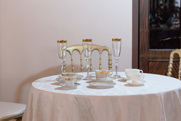 Wall Mural - A view from afar on a table served with champagne flutes, demita