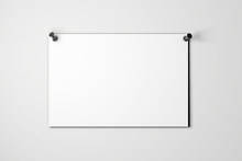Blank White Poster Pinned To A Plain Wall With Pushpins