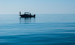 Silhouette of Sport Fishing boat in calm water