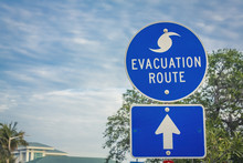 Hurricane Evacuation Route Road Sign On Blue With Arrow