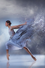 Wall Mural - The beautiful ballerina dancing in blue long dress 