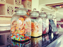 Colorful Candies In Glass Jars In Candy Shop