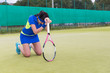 © kolotype - Female player is upset and  fell on her knees because of the los
