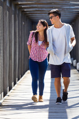 Happy young couple looking at the views in the city.