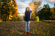 © Tanee - Cute Teenager girl walks in Autumn park. Sunny day, selective focus