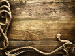 old rope on vintage wooden background