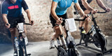 Fototapeta  - sports clothing people riding exercise bikes