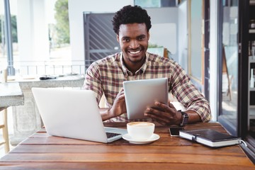 Poster - Man using digital tablet