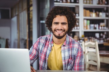Poster - Portrait of happy man with laptop