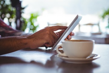 Poster - Hands of man using digital tablet