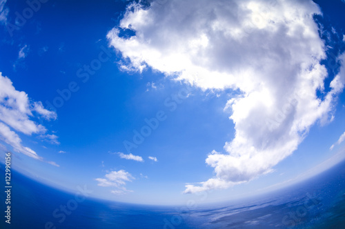 Fotografie, Obraz Clouds and ocean. Special effect fisheye. Madeira. Portugal