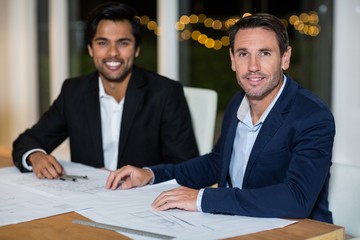 Poster - Businessmen sitting at their desk in the office