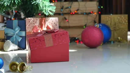 Wall Mural - Cute tabby kitten playing in a gift box with Christmas decoration