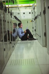 Aufkleber - Technician siting on floor and using digital tablet