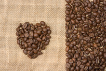 Coffee Beans With Heart Shape On Gunny Sack Background
