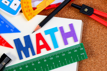 School math office supplies. Wood letters as Math word with mathematics drawing icon. Math concept.