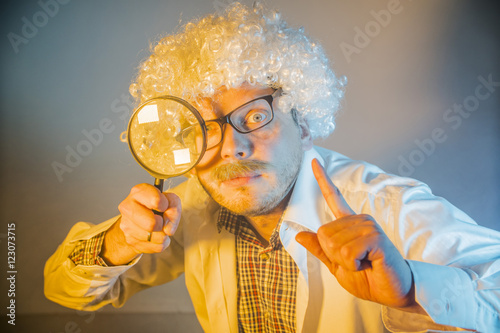 funny scientist, like Einstein with a magnifying glass Poster