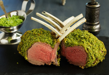 Canvas Print - Rack of lamb in herb cheese and breadcrumbs. A festive meal. Selective focus.