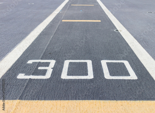 Poster road surface Roads are numbered 300 meters