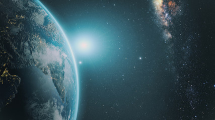 sunrise over earth as seen from space. with stars background.