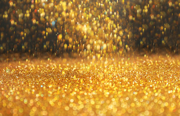 Wall Mural - Shining golden sparkles and grey background