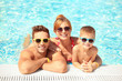 © Africa Studio - Happy family in swimming pool at water park
