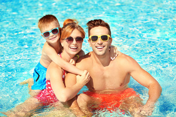 Canvas Print - Happy family in swimming pool at water park