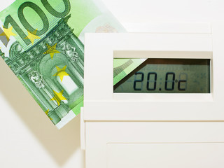 Concept thermostat and banknote for heating expensive