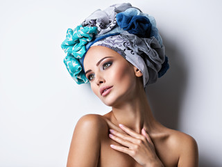 Sexy portrait of a beautiful girl with turban on head.