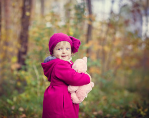 Wall Mural - Little girl in autumn park