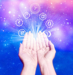female hands with seven symbol of chakra like a conncept for healing energy
