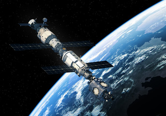 Wall Mural - international space station orbiting earth
