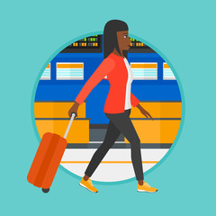 Poster - Woman walking with suitcase at the airport.