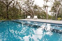 Stunning Blue Tiled Infinity Swimming Pool In Australian Bush Se