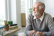 © Rawpixel.com - Senior Adult Looking Outside WIndow Relax Concept