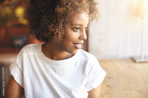 African Woman In White Trendy Shirt Waiting For Friends To Join
