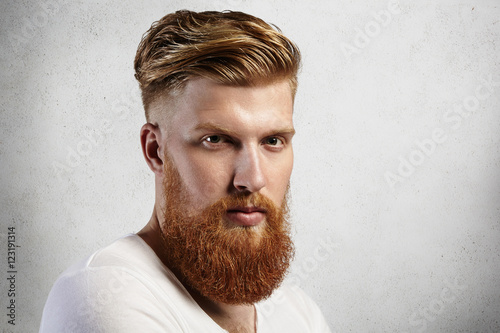 Fotografie, Obraz Sideways portrait of natural blond Caucasian man on white background