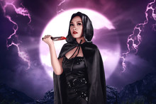 Young Beautiful Asian Witch Holding Bloody Knife