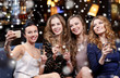 © Syda Productions - women with champagne taking selfie at night club