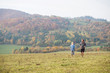 © Halfpoint - Beautiful young couple running in sunny autumn nature.
