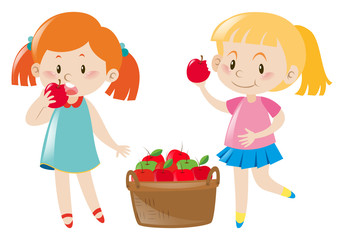 Two girls eating red apples