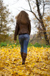 © Andrey_Arkusha - Autumn fashion image of young woman walking in the park