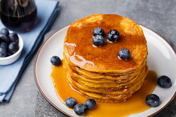 Wall Mural - Pumpkin pancakes with maple syrup and blueberries